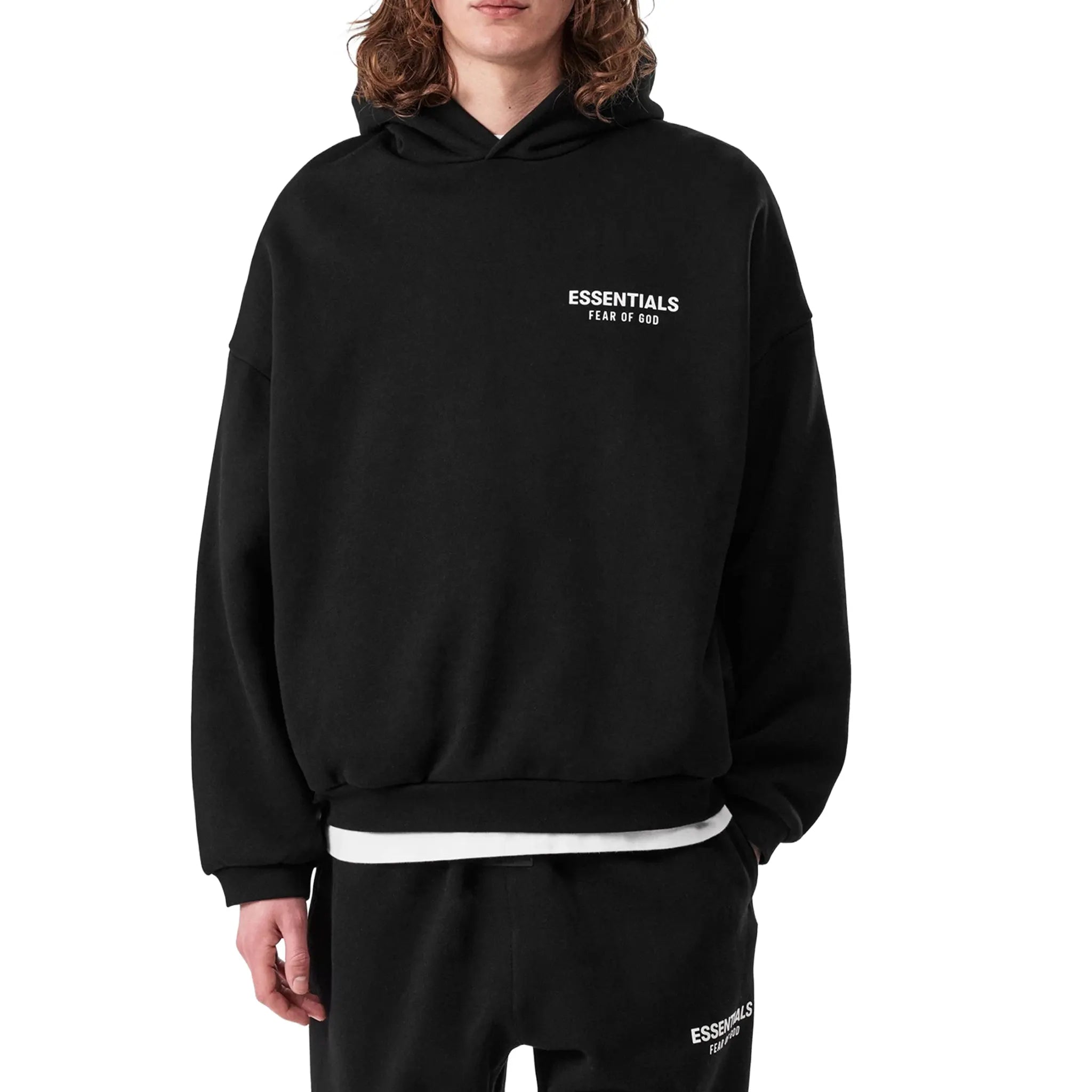 Model Front View of Fear Of God Essentials Fleece Black Hoodie (FW24) 192BT246250F